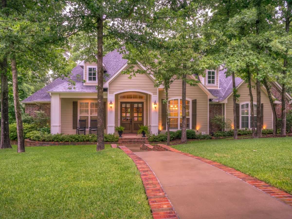 An inviting, beautiful home with excellent tree coverage in the yard.